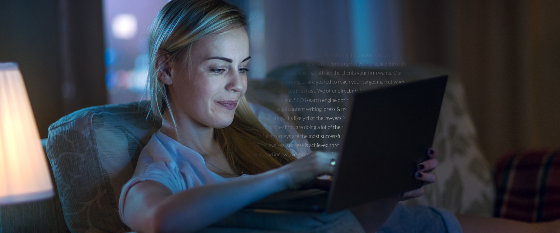 Woman looking at laptop where words are coming out of it
